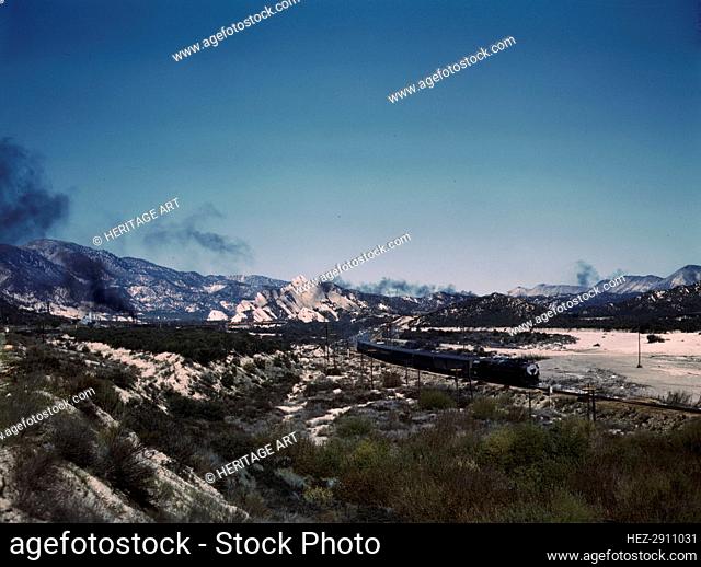 Santa Fe R.R. trains going through Cajon Pass in the San Bernardino Mountains, Cajon, Calif., 1943. Creator: Jack Delano