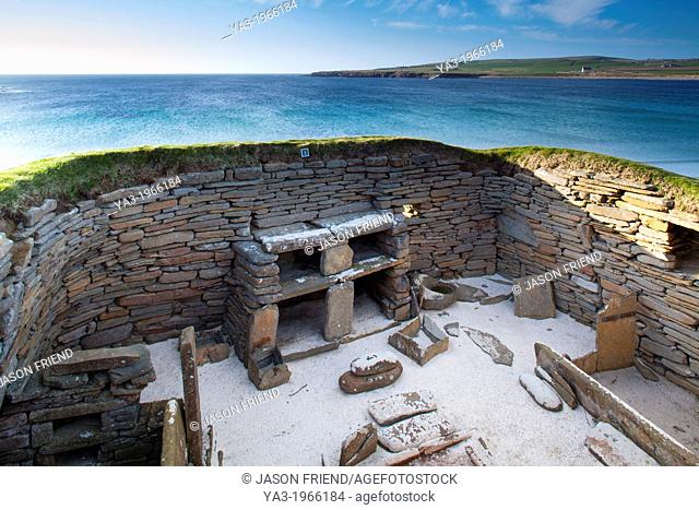 Scotland, Orkney Islands, Skara Brae Prehistoric Village. Skara Brae, a stone-built Neolithic settlement, located on the Bay of Skaill on the west coast of...