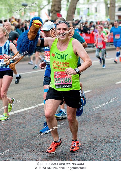Tony Audenshaw who plays Bob Hope in TV's Emmerdale wears big ears and carries an Emu puppet whilst running in the London Marathon 2015