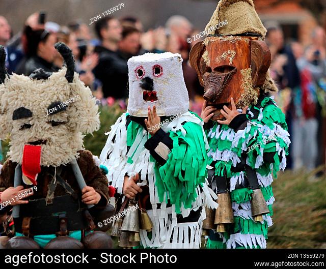 Zemen, Bulgaria - March 16, 2019: Masquerade festival Surva in Zemen, Bulgaria. People with mask called Kukeri dance and perform to scare the evil spirits