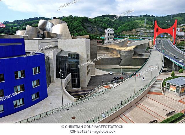 ''L'arc rouge'' The Red Arch by the French artist Daniel Buren on La Salve Bridge official name ''the Prince and Princess of Spain Bridge'' in the background of...
