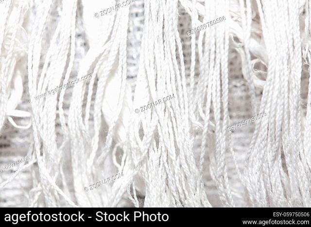 white canvas texture background with filament. close up