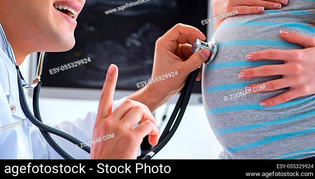 The pregnant woman visiting doctor for regular check-up