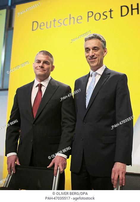 CEO of Deutsche Post AG Frank Appel (R) and new board member John Gilbert (L) arrive to the company's annual balance press conference in Bonn, Germany
