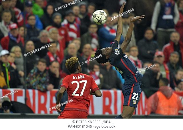 Munich's David Alaba (L) in action against Madrid's Thomas Teye Partey during the UEFA Champions League semi final second leg soccer match between Bayern Munich...