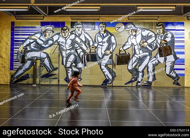 Stockholm, Sweden A child runs on the platform in the Akalla subway station in the Akalla suburb, mural designed by Birgit Ståhl-Nyberg