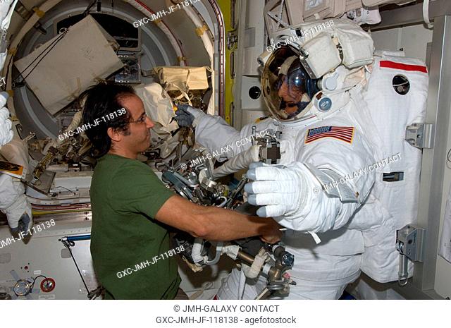 NASA astronauts Joe Acaba and Sunita Williams, both Expedition 32 flight engineers, prepare for the start of the mission's second session of extravehicular...