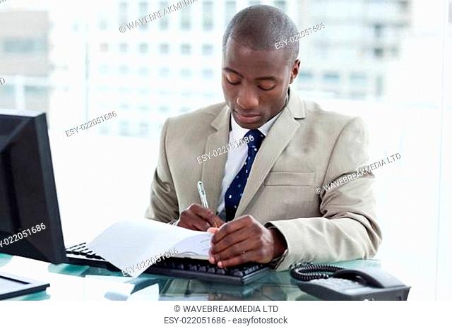Young entrepreneur signing a document