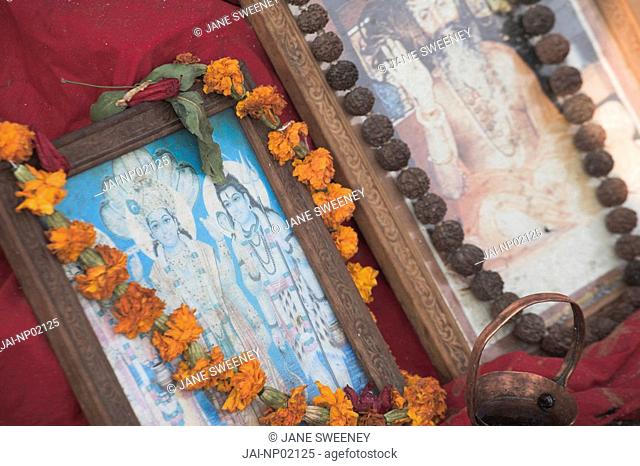 Nepal, Kathmandu, Pashupatinath Temple, Shivaratri festival, Hindu images adorned with flowers and rosary beads