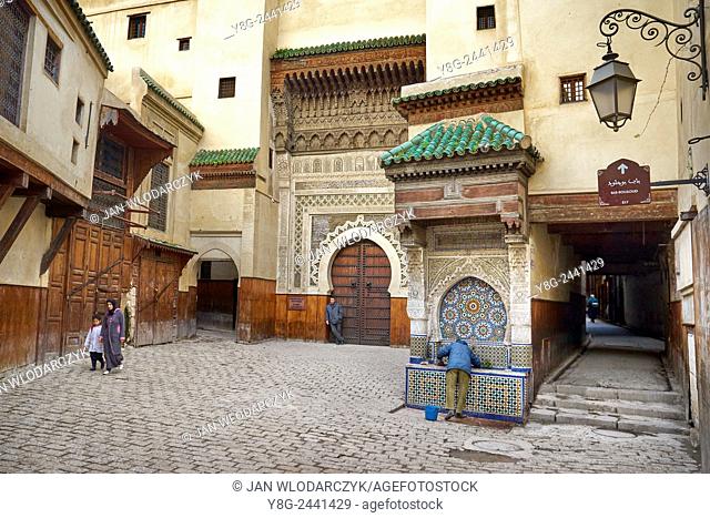 Fez, Place Nejjarine. Richly decorated with mosaics, the seventeenth-century fountain and door to the road house for caravans. Morocco