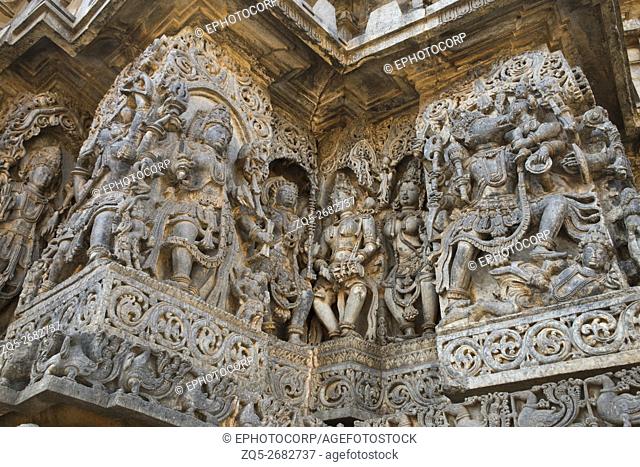 Sculptures west side walls. Shiva on the left and Varaha on the right. Hoysaleshwara temple, Halebidu, Karnataka, india. view from West