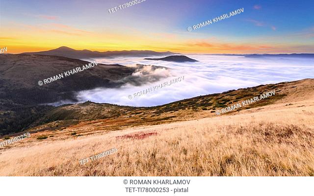 Ukraine, Zakarpattia region, Rakhiv district, Carpathians, Chornohora, Sheshul, Mist over mountains at dawn