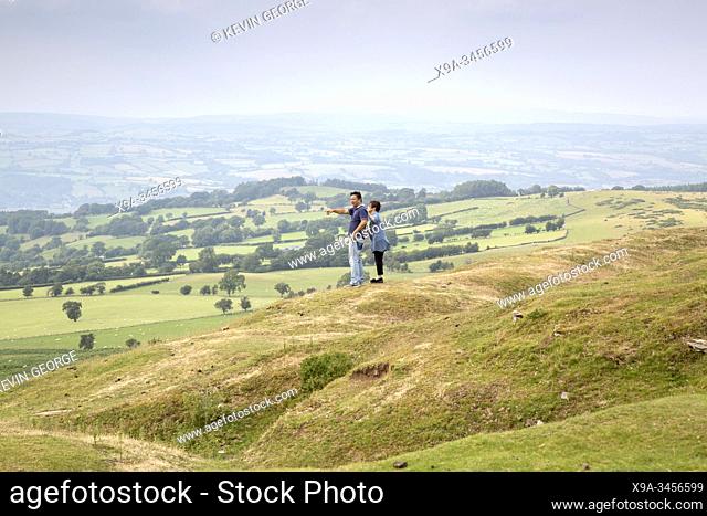 Couple Looking at View from Hay Bluff, Breacon Beacons, Wales, UK