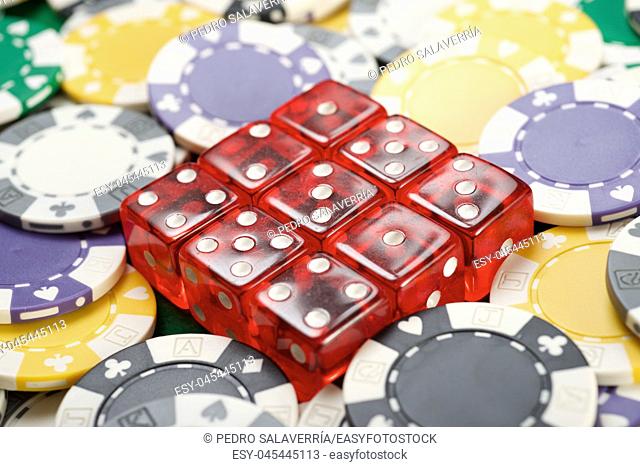 casino chips and dices on a green felt