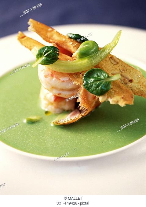 Pan-fried Dublin Bay prawns, almond croquant and watercress and broad bean sauce