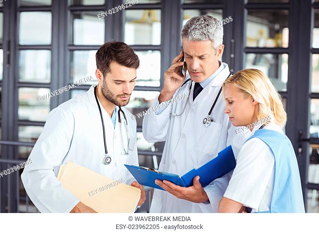 Senior doctor working with coworkers