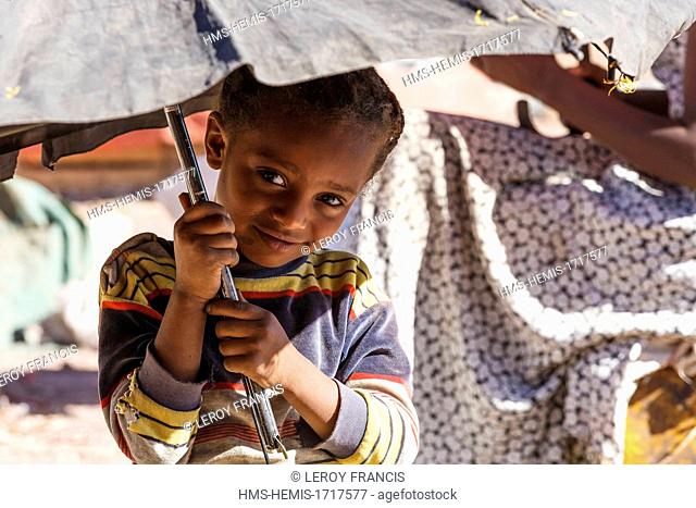 Ethiopia, Amhara region, Gondar, little girl holding an umbrella portrait