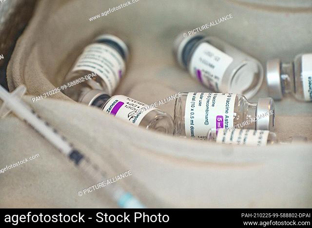 25 February 2021, Rhineland-Palatinate, Mainz: Empty vials of AstraZeneca's Corona vaccine lie in a tray at a police vaccination center at the start of...