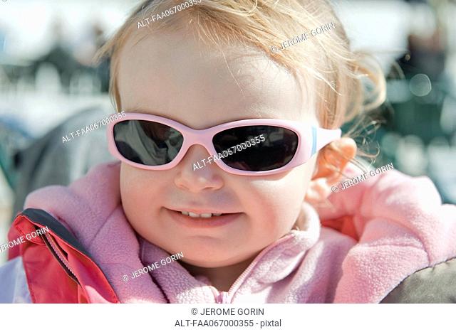 Toddler girl wearing sunglasses, portrait