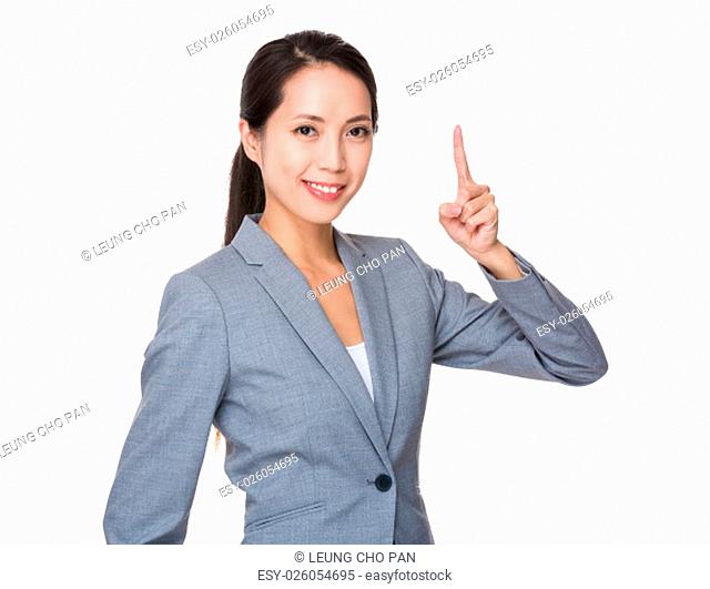 Businesswoman showing finger point up
