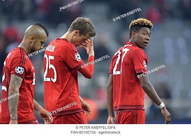 Munich's Arturo Vidal (L-R), Thomas Müller und David Alaba react after the Champions League semi-final second leg soccer match between Bayern Munich and...