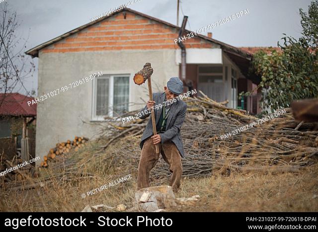25 October 2023, Turkey, Kirklareli: 102-year-old Aziz Gündogdu gardens in the backyard of his house in the village of Doganca, in northwestern Lanes