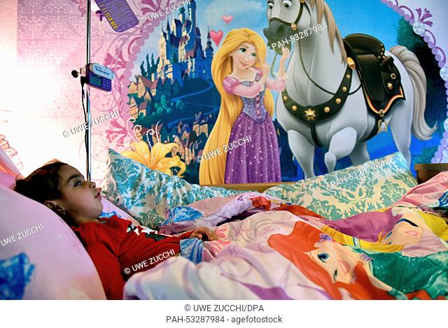 Sick Aliana lies in her bed in Bad Hersefeld, Germany, 30 October 2014. Aliana suffers from chronic, progressive encephalitis (SSPE)