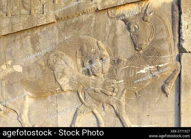 Scene from Persian mythology in the Apadana stairs, Persepolis, Iran