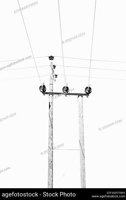 wood pylon energy and current line  in oman the electric cable