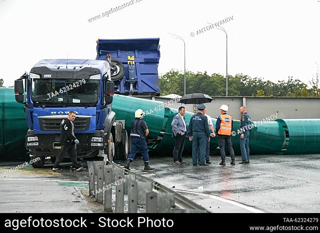 RUSSIA, PRIMORYE REGION - SEPTEMBER 18, 2023: A truck with its dump body up causes a pedestrian overpass outside Vladivostok to collapse on a highway to...