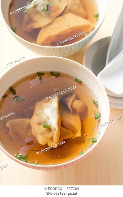 Clear broth with wontons and mushrooms Asia