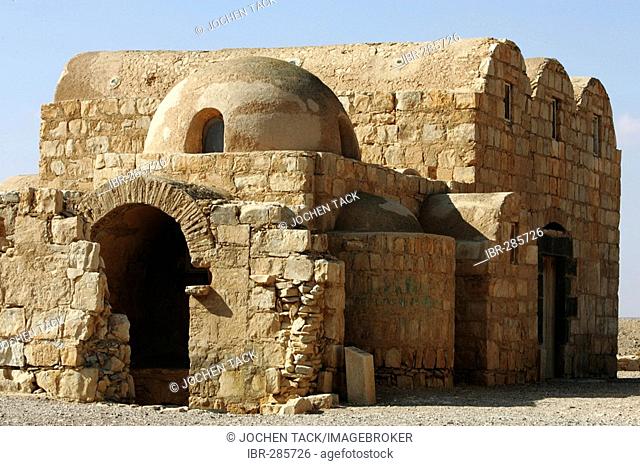 JOR, Jordan : Desert castle Qusair Amra, red Palace bathhouse, UNESCO World heritage site. With many frescos inside the building. |