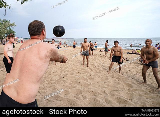 RUSSIA, DONETSK PEOPLE'S REPUBLIC - JUNE 18, 2023: People play beach volleyball by the Sea of Azov in Mariupol. The Donetsk People's Republic has acceded to...