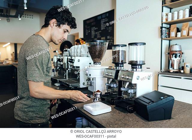 Barista preparing coffee in a coffee bar