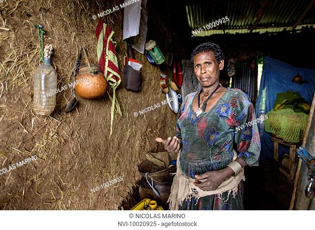 A mother at her traditional house in the north of Ethiopia