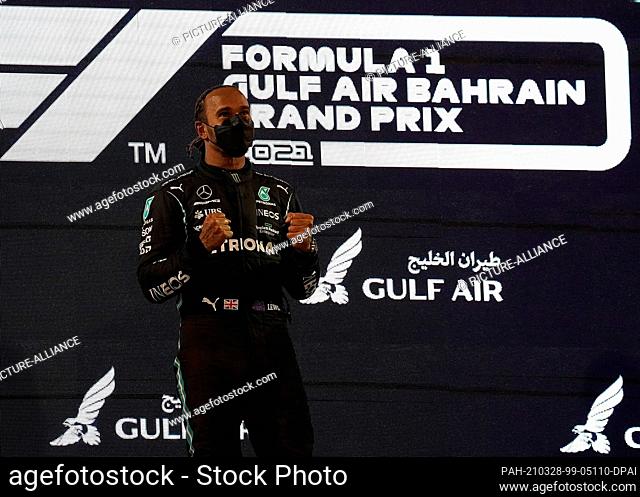 28 March 2021, Bahrain, Sakhir: Motorsport: Formula One World Championship, Bahrain Grand Prix, podium. Winner Lewis Hamilton of the Mercedes-AMG Petronas...