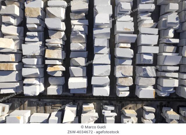 Aerial photographic documentation of a warehouse of white marble blocks ready for shipment