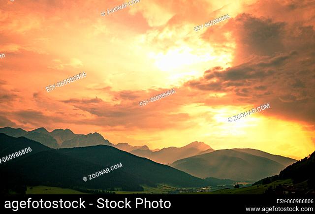 Mountains under sunset light, as seen from Cinque Torri, Dolomite Alps, Italy in summer