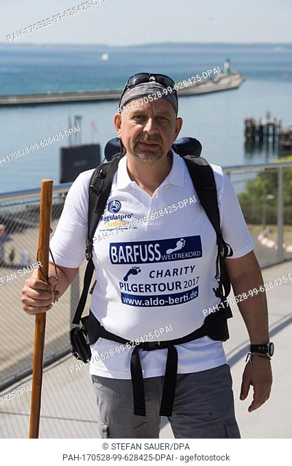 Aldo Berti prepares for his attempt to break the world record in barefoot walking in Sassnitz, Â Germany, 28 May 2017. The man from the Black Forest region...