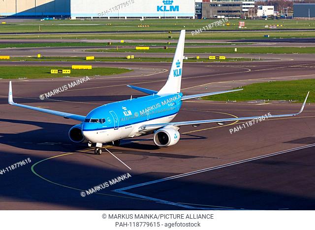 Amsterdam, Netherlands – April 19, 2015: KLM Royal Dutch Airlines Boeing 737-700 airplane at Amsterdam Schiphol Airport (AMS) in the Netherlands