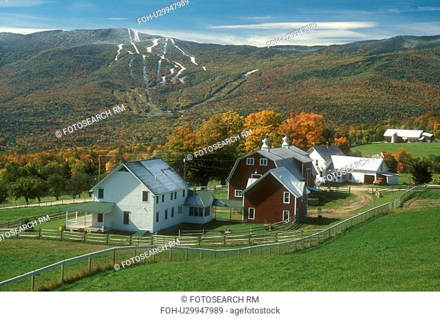 farm, fall, Fayston, VT, Vermont, Scenic view of the Green Mountains and Sugarbush Ski Resort at Mt. Ellen after the first snow from a farm in the Mad River...