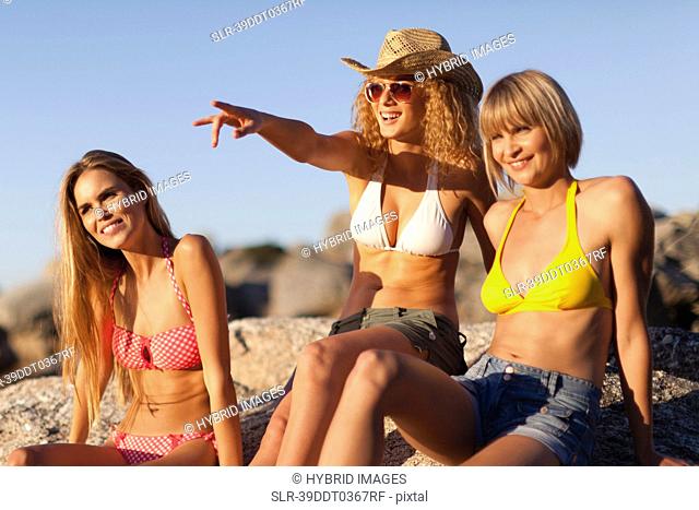 Women admiring beach together