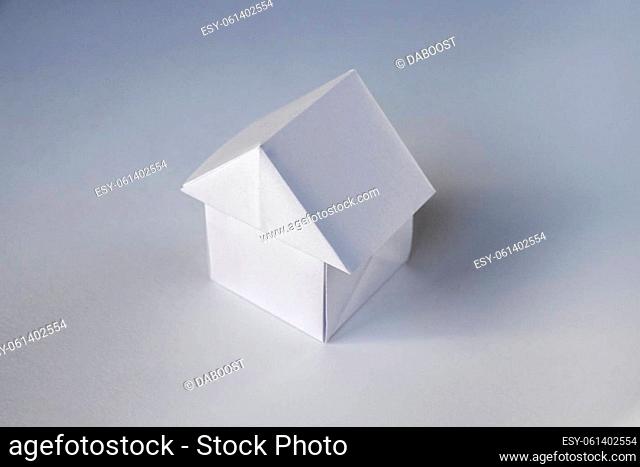 Paper house origami isolated on a blank white background