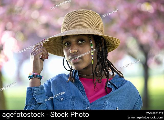 A Black teenage girl poses for the camera