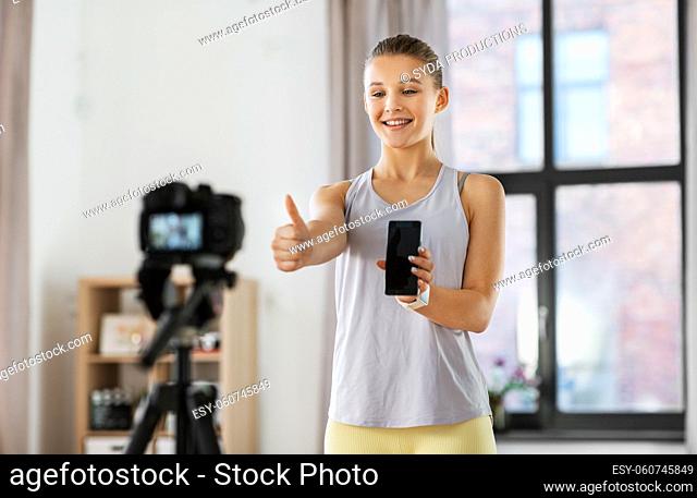 teenage girl or blogger recording gym class video