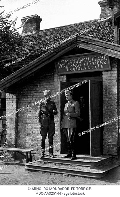 Two Italian officers talking. Two Italian officers speaking in front of CSIR (Italian Expeditionary Corps in Russia) command in the Seversky Donets area