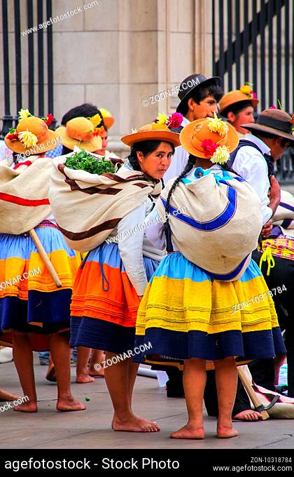 Local women standing during Festival of the Virgin de la Candelaria in Lima, Peru. The core of the festival is dancing and music performed by different dance...