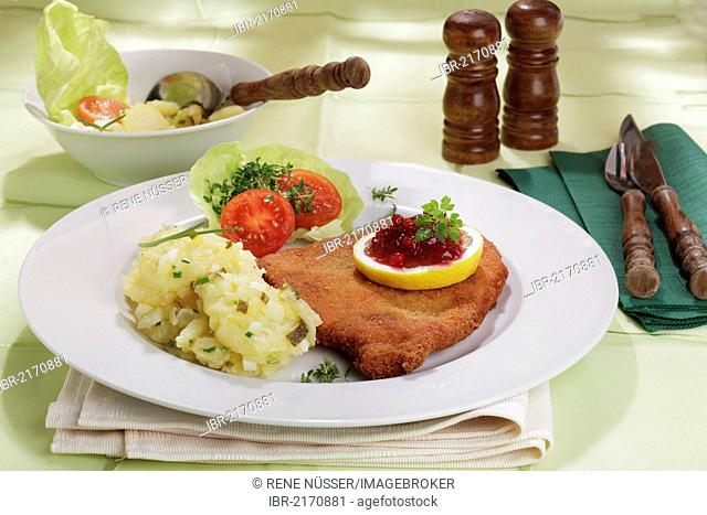 Viennese Schnitzel with lemon and cranberries, potato salad