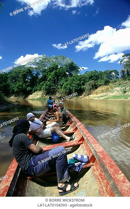 Alto Madidi. River Madidi. Amazon basin. Jungle trip. Dugout canoe, boat. Muddy water. Five people. Boatman