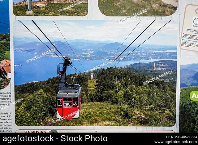 Tourist posters of the cable car. A cabin of the cable car for Mottarone just reopened after the lockdown crashed, 14 dead , Stresa, ITALY-24-05-2021